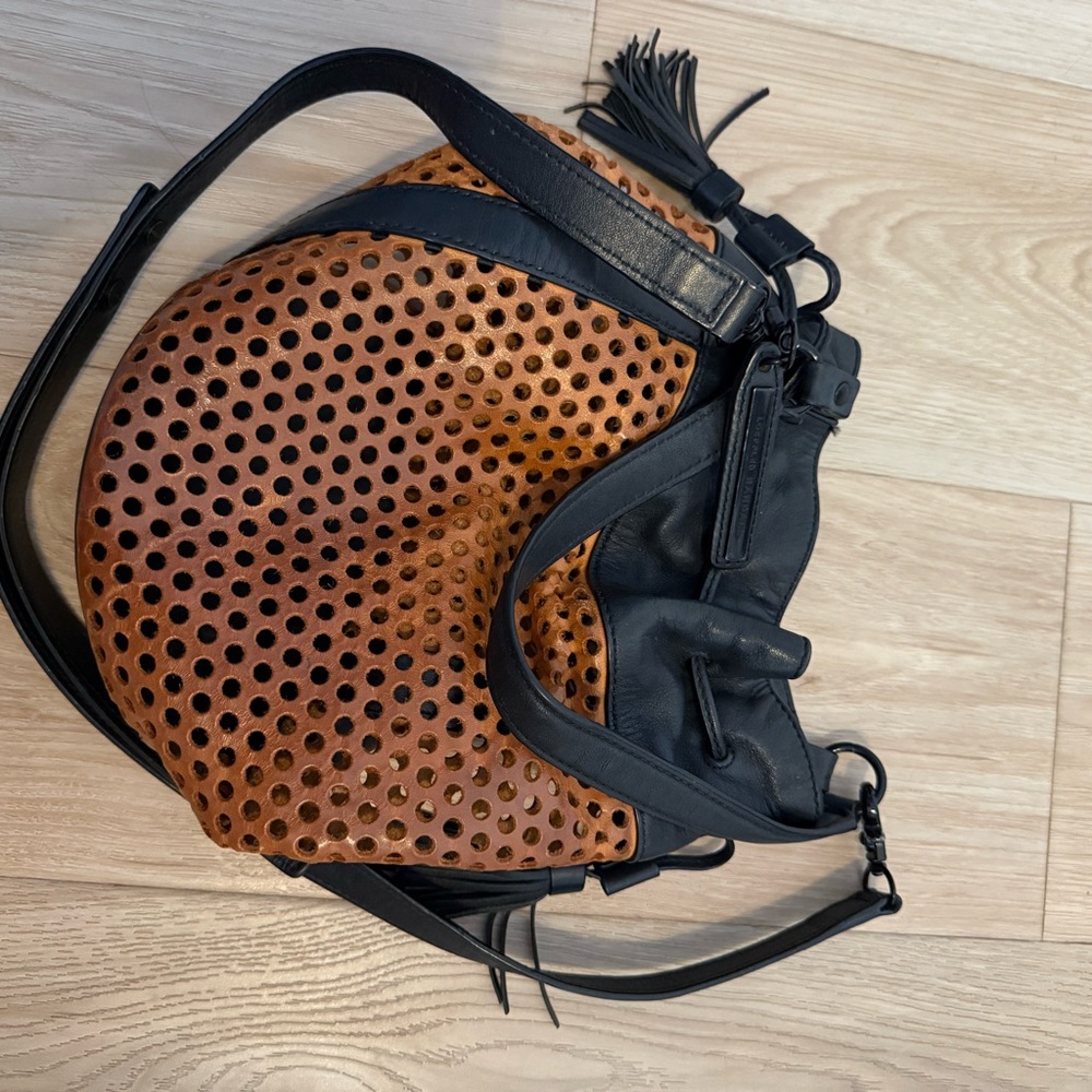 loeffler randall 

Brown and Black Perforated Shoulder Bag